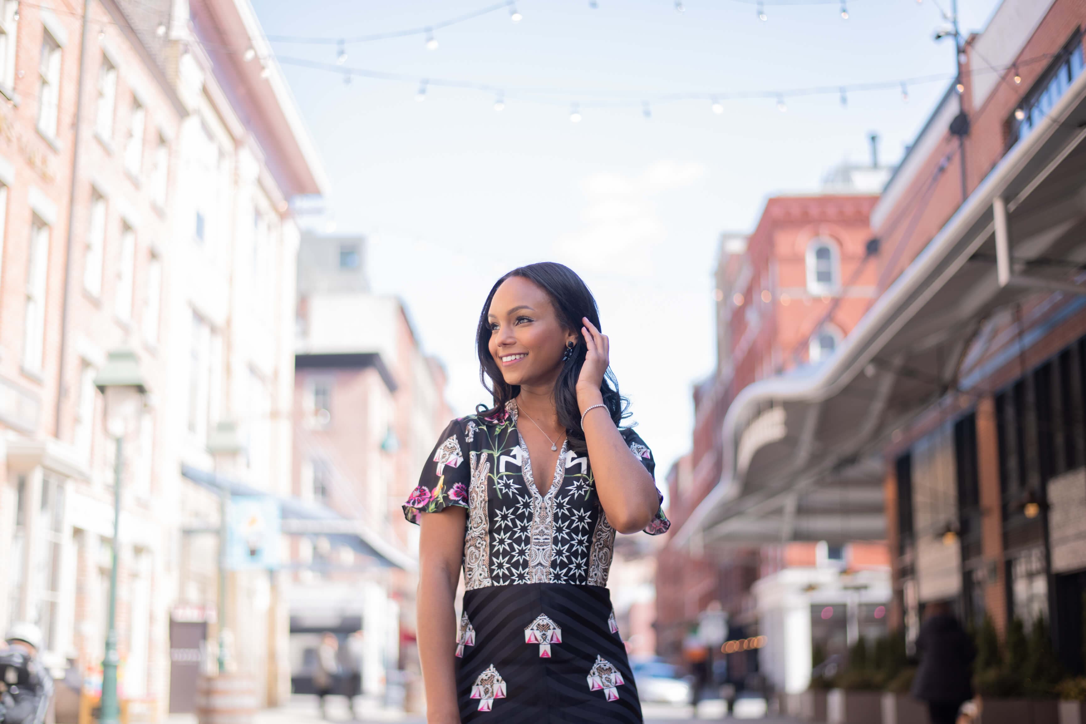woman posing for a branding photoshoot on a busy street
