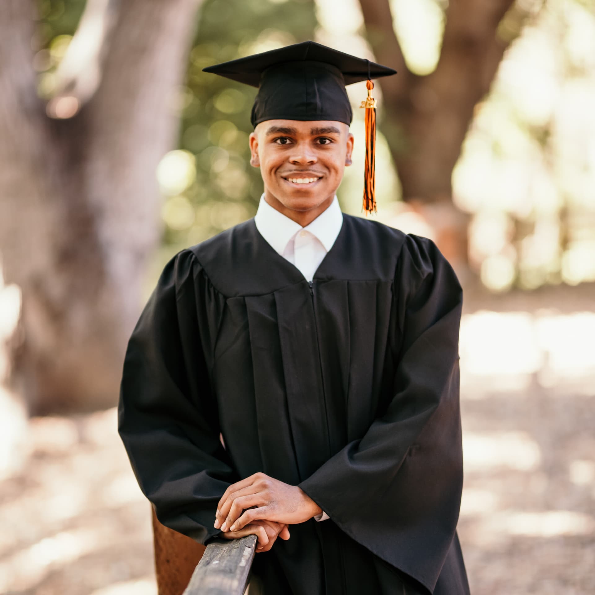 Male graduate posing in cap and gown