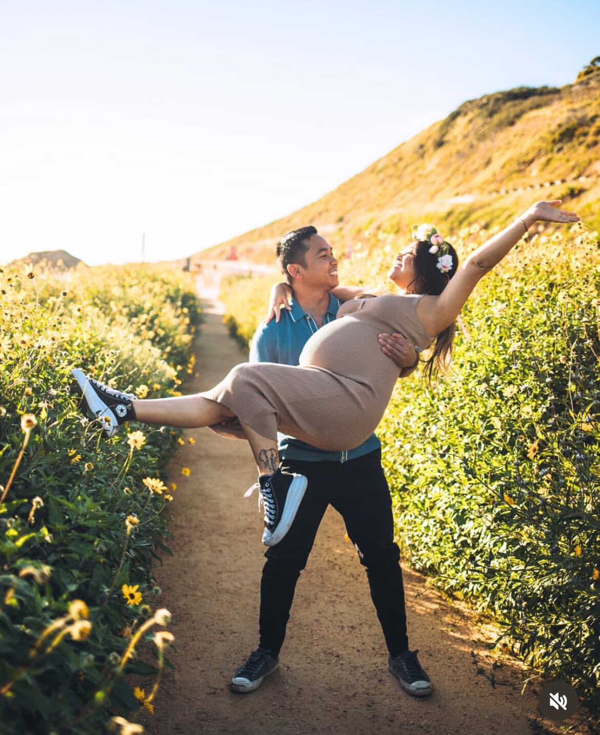 Couple celebrating during a maternity photoshoot