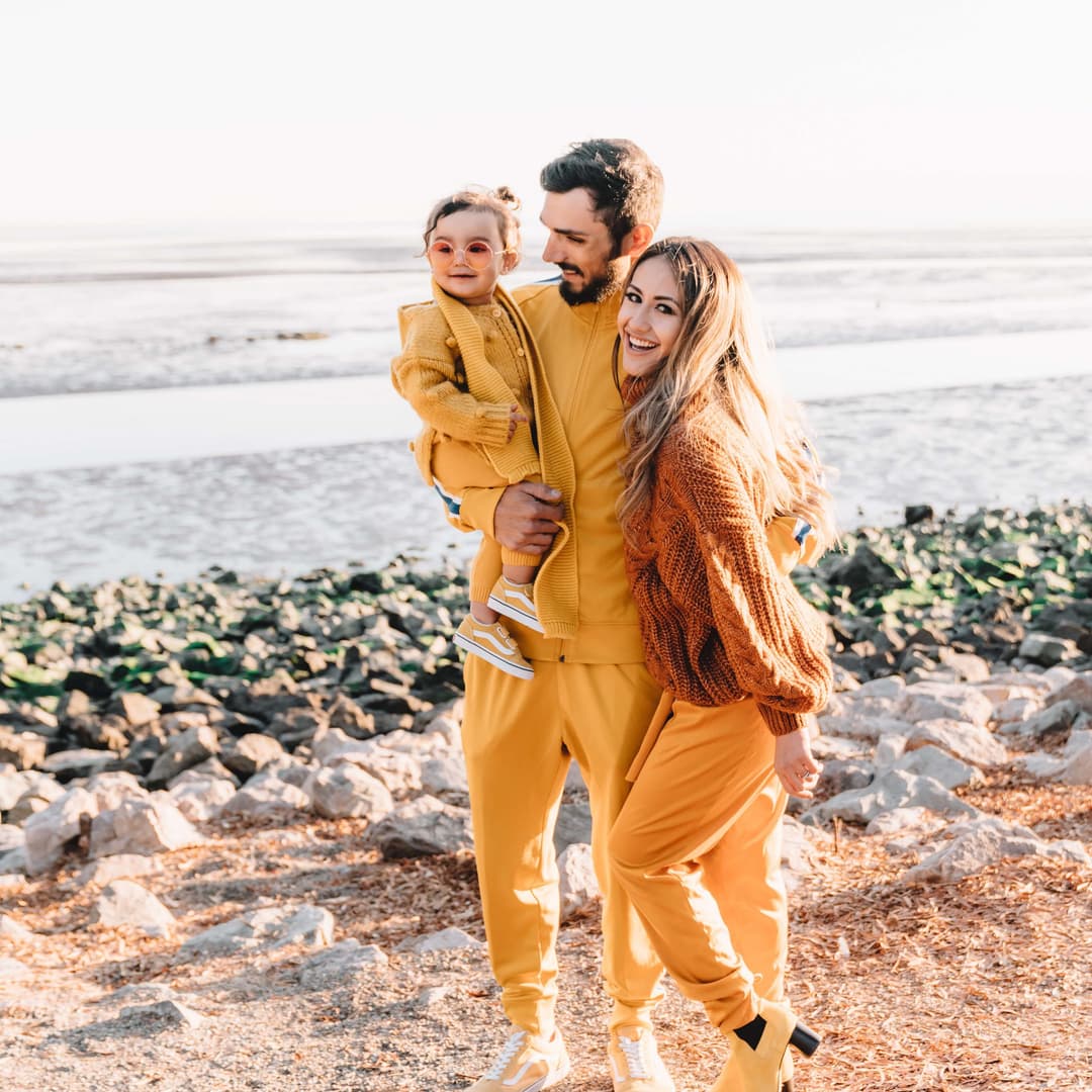 happy family posing for a photoshoot on the beach