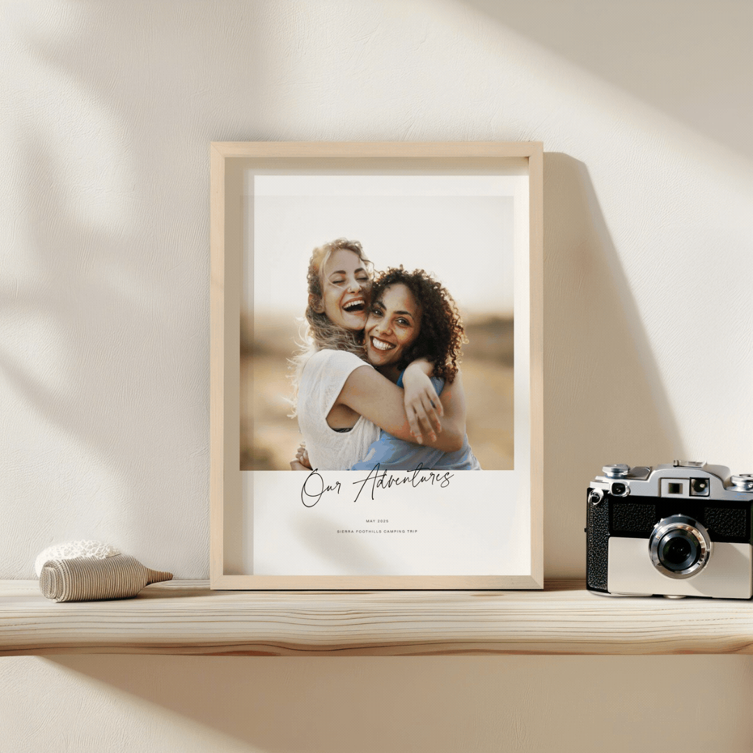 Paper Culture black-and-white framed print of a mother and child, displayed in a living room