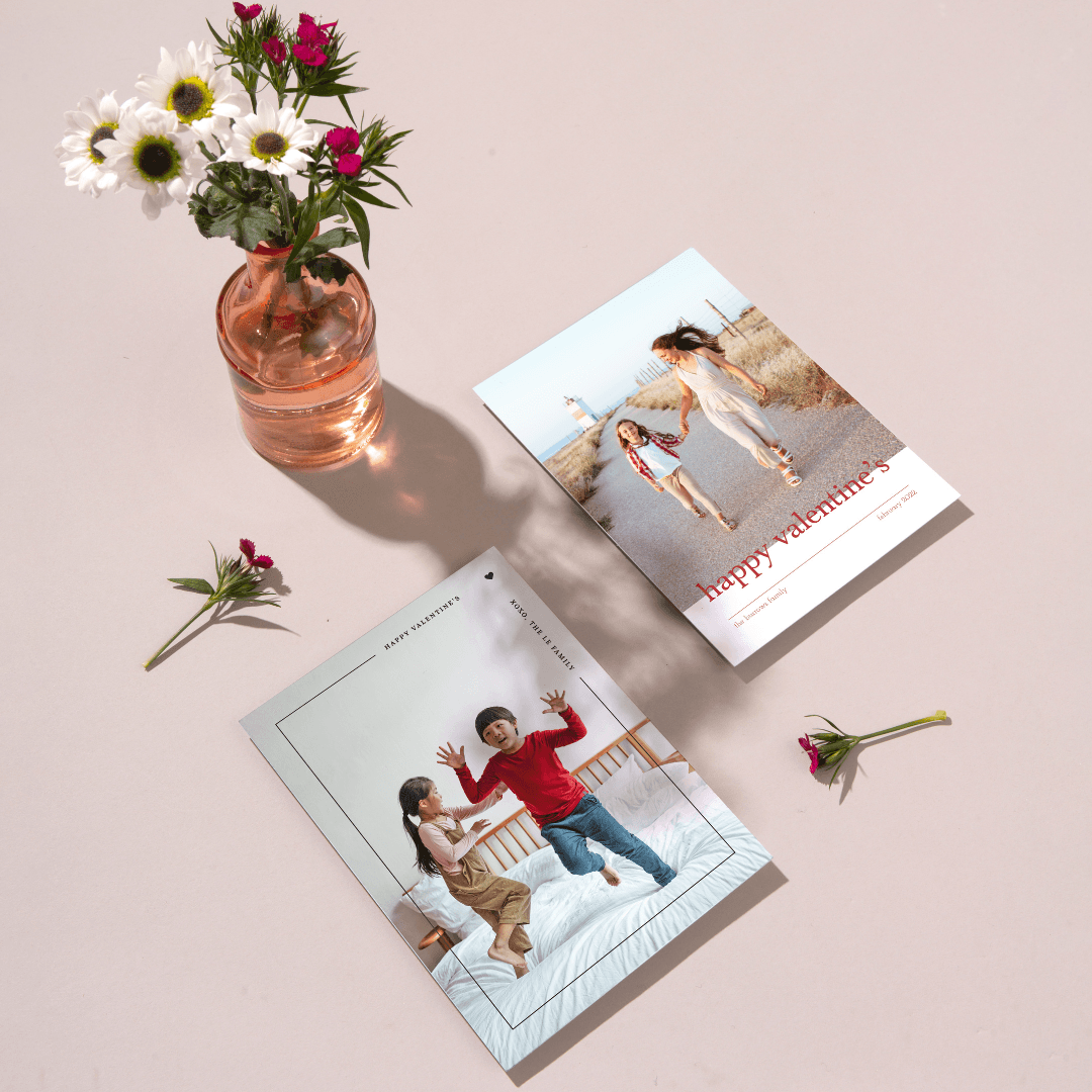 Paper Culture Valentine's Day printed cards displayed on a tabletop with a flower vase