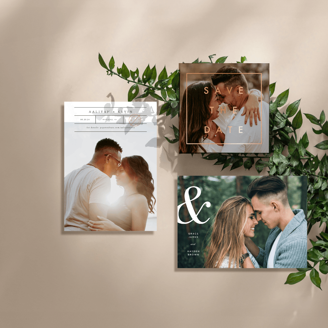 Paper Culture printed cards featuring couple photos arranged on a wall with greenery