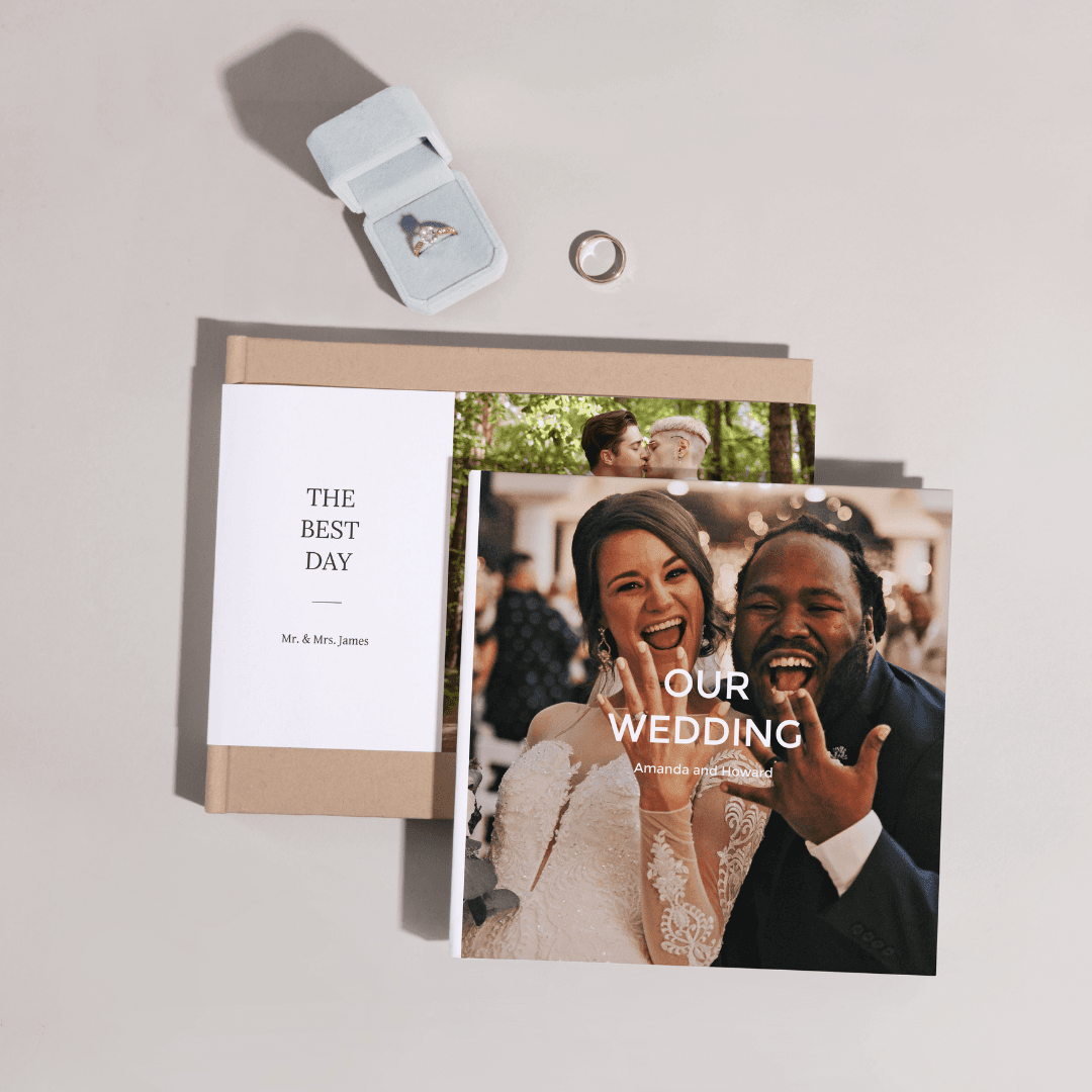 Paper Culture wedding photobook with 'Our Wedding' cover, displayed with a ring box