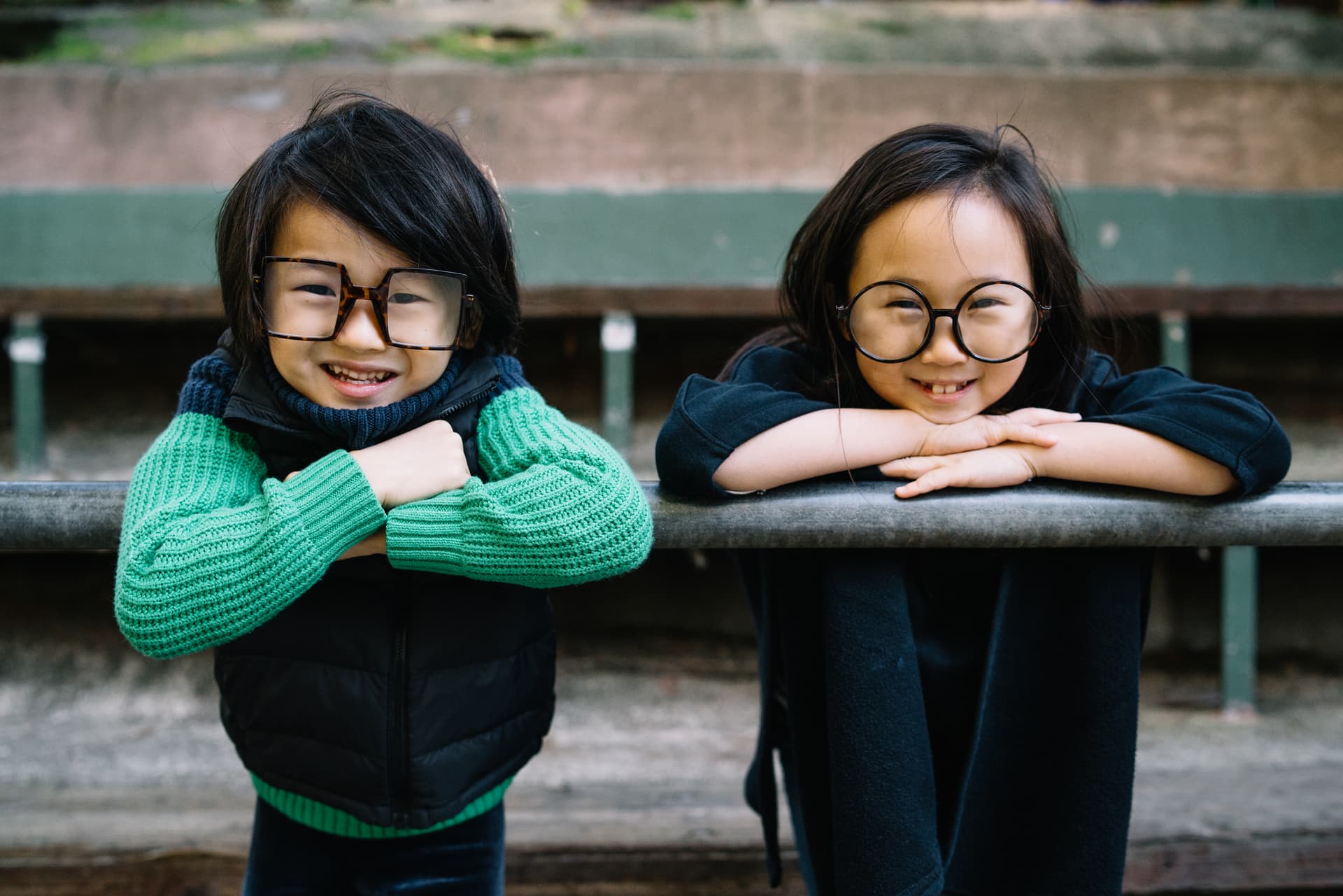 Two kids with glasses smiling