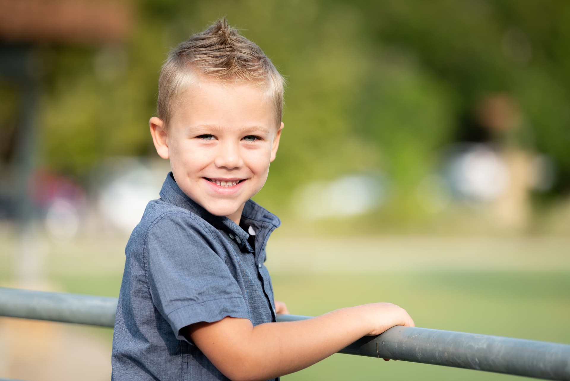 Boy smiling outdoors