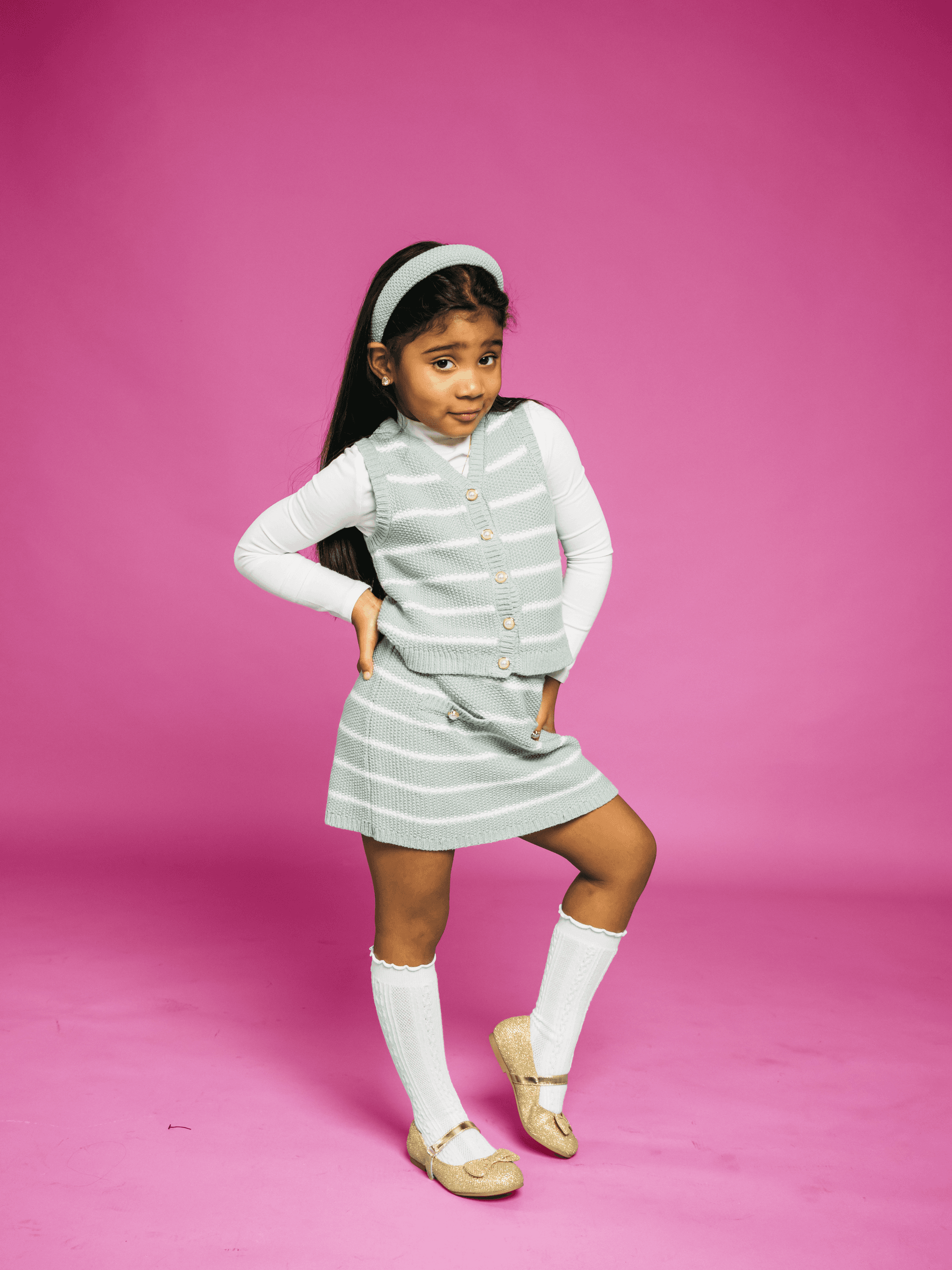 Girl posing on pink background