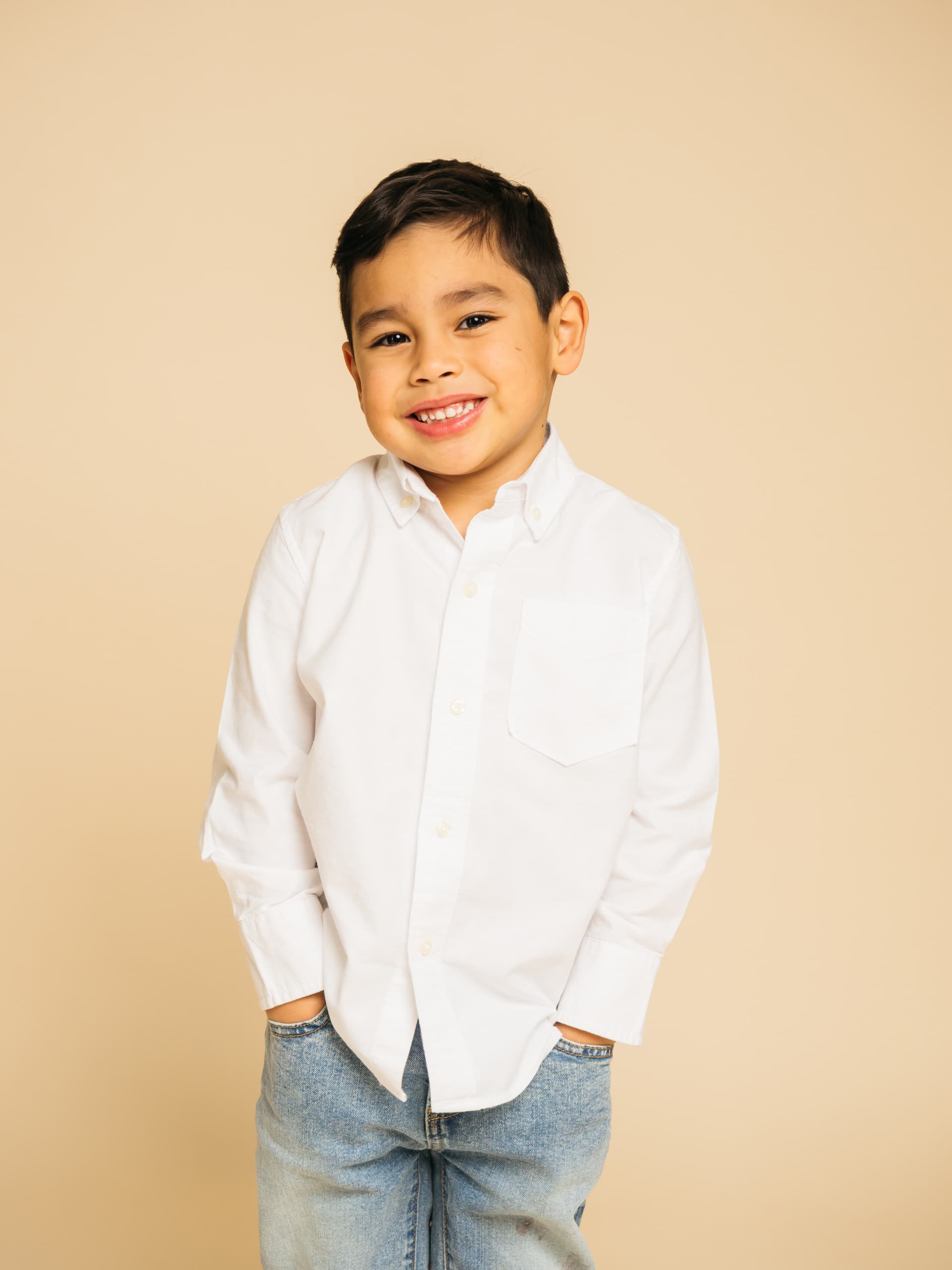 Boy smiling in white shirt