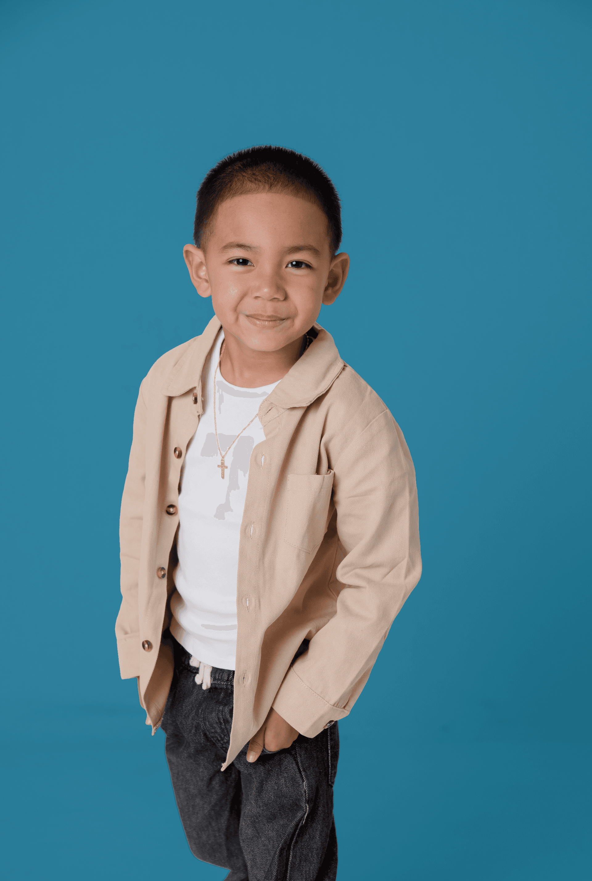 Boy posing on blue background
