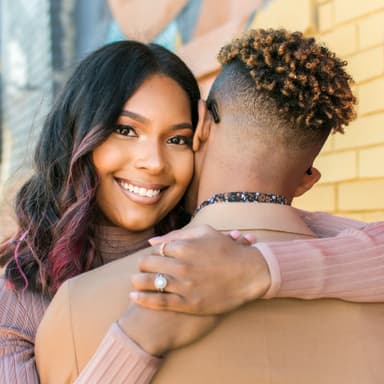 Couple hugs for their free outdoor engagement photoshoot