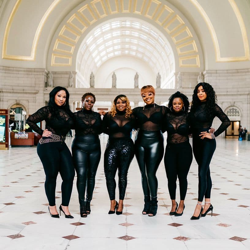 six women in the middle of Central Station in New York.