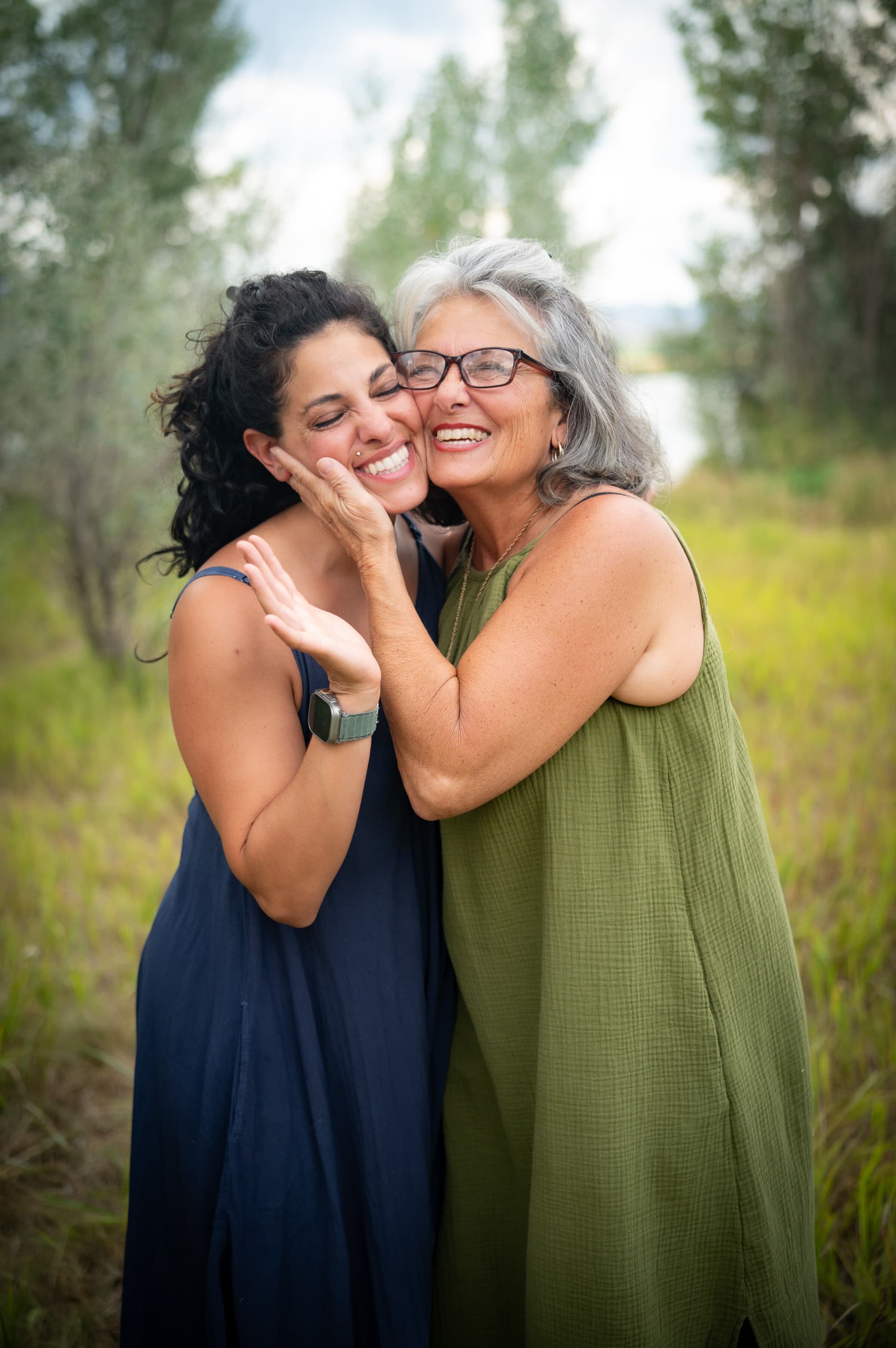 Mother and grandmother smiling together in a portrait