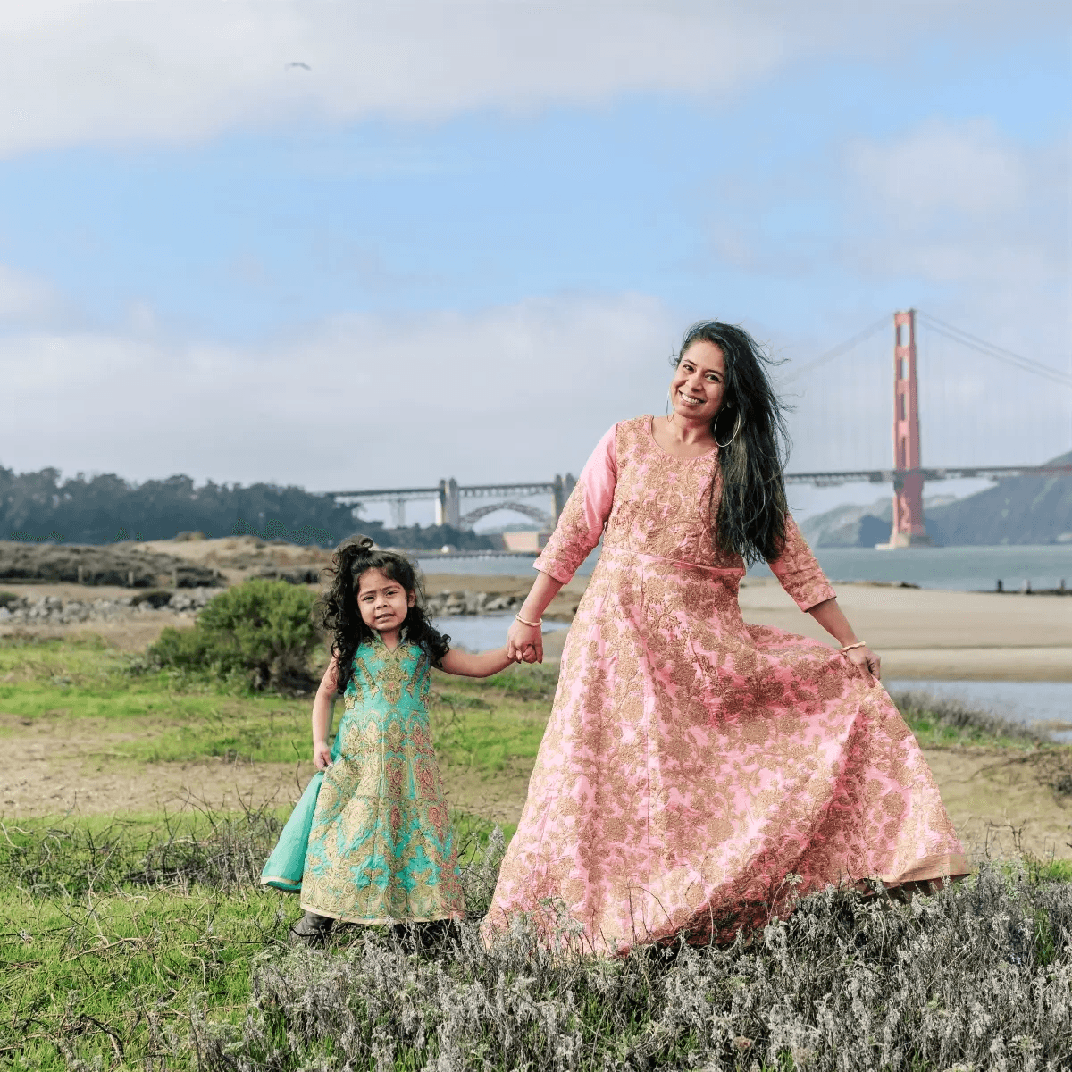 Mom and child posing together outdoors