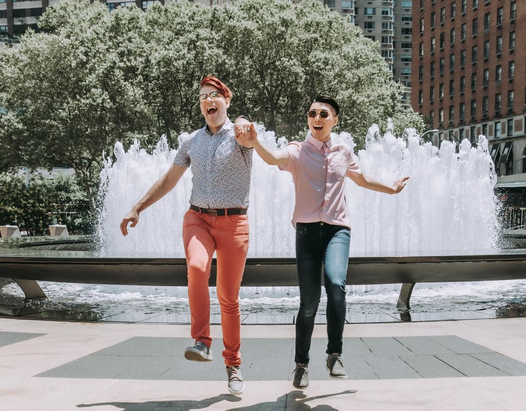 PRIDE couple skipping