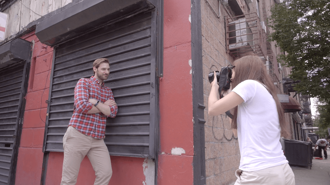 Photographer taking photos of a man